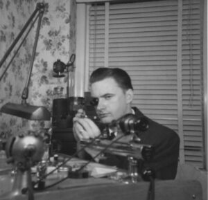Dad repairing watches at home office (1953)