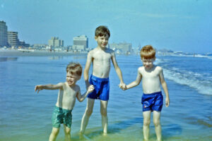 Neil, Me, and Bob holding hands at shore (1961)