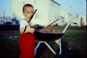 Steve helping Dad plant flowers (1967)