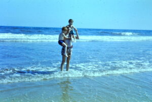 Dad lifting Bob and Neil out of ocean (1961)